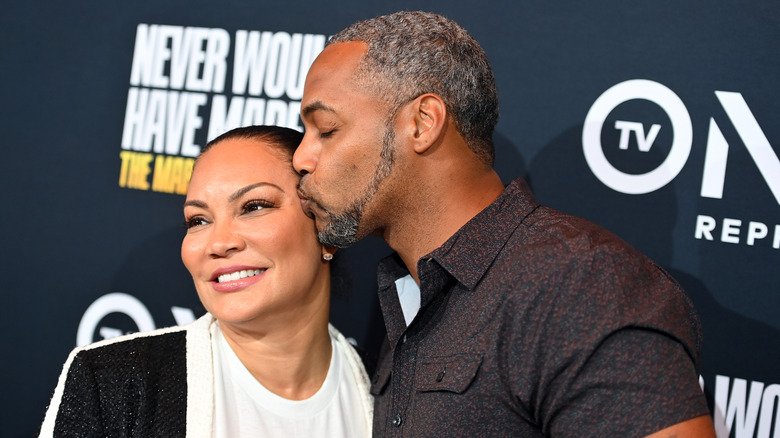 Egypt Sherrod smiles as Mike Jackson kisses her on the cheek