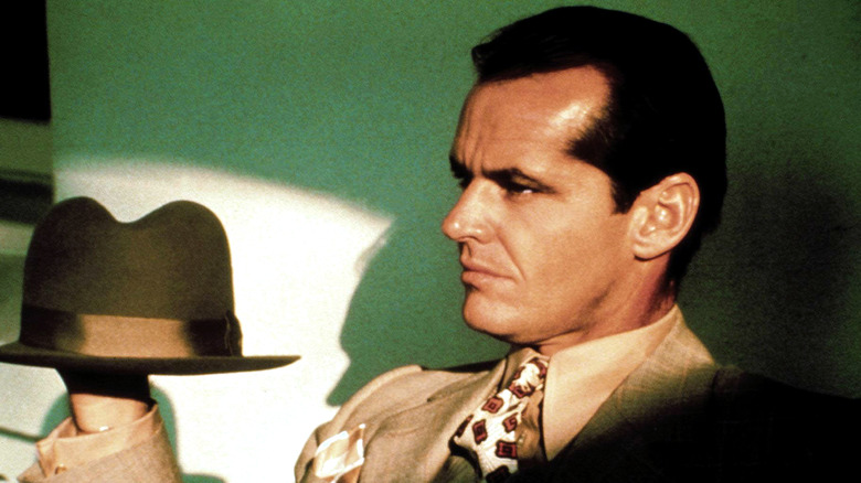 Jack Nicholson holding his hat in "Chinatown"