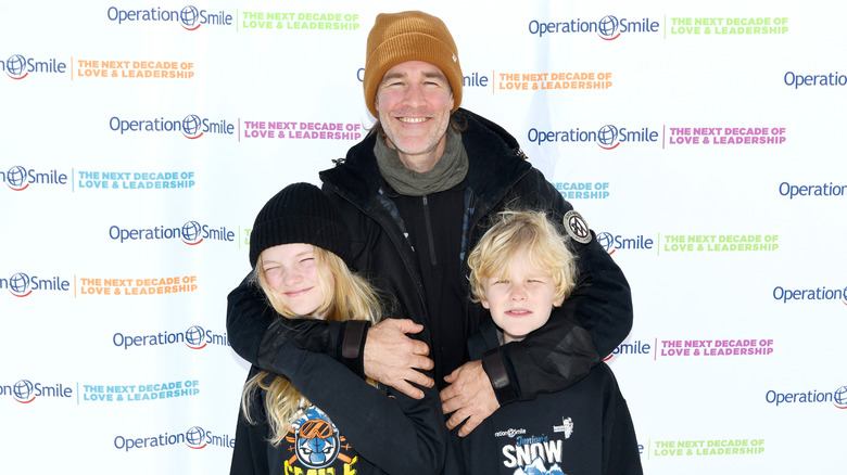 James Van Der Beek hugging two of his children