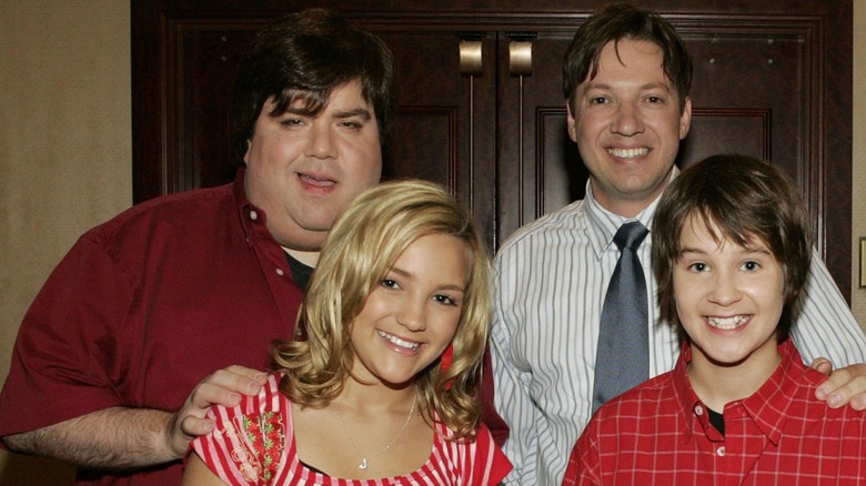 Dan Schneider touching Jamie Lynn Spears' shoulders