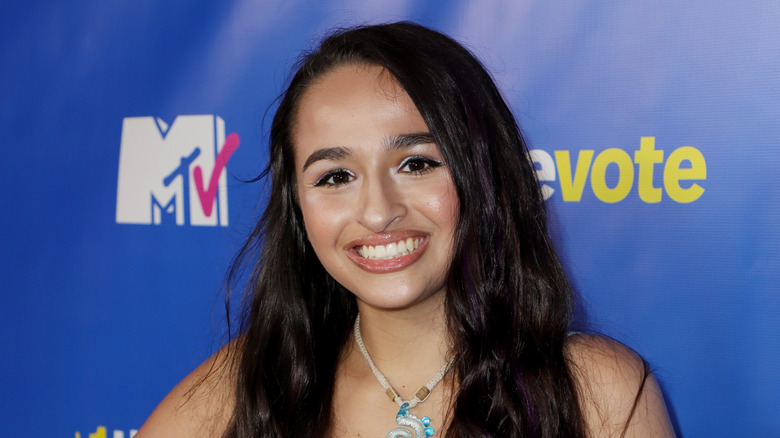 Jazz Jennings smiling at the camera at an MTV press event