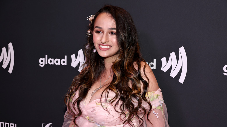 Jazz Jennings wearing a pink dress and smiling