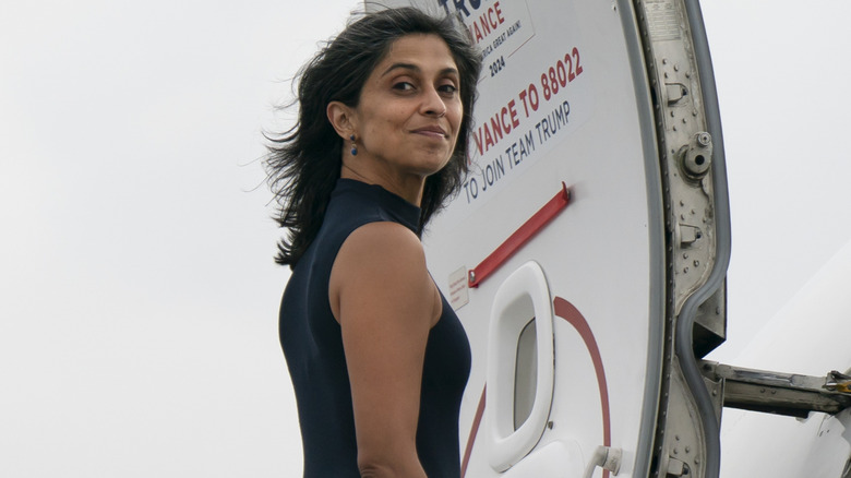 Usha Vance smiling while looking over her shoulder