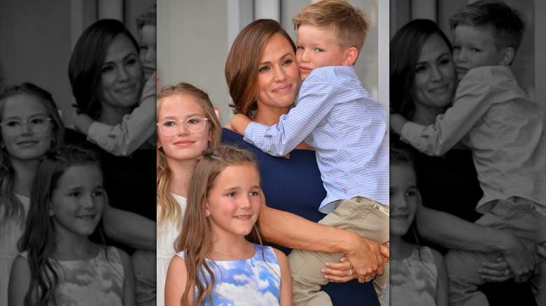 Jennifer Garner holding son Samuel with daughters Violet and Seraphina beside her