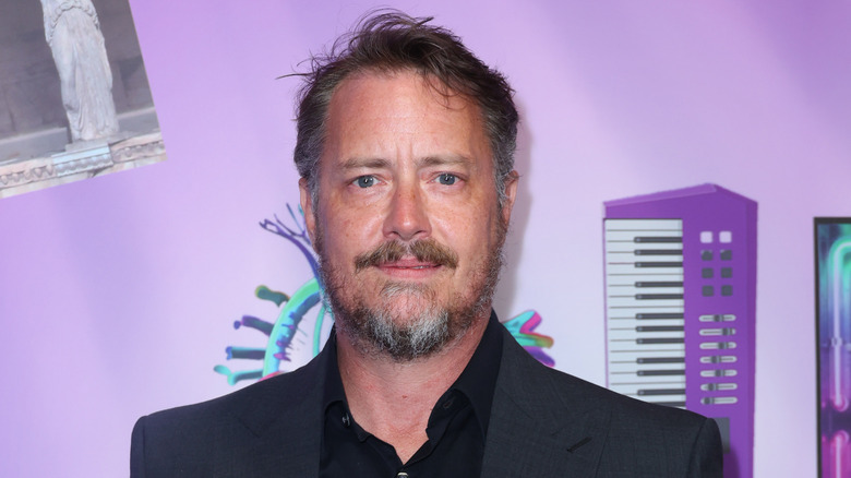 Jeremy London against purple background