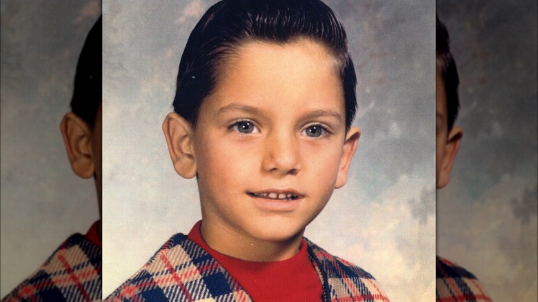 a young John Stamos smiling