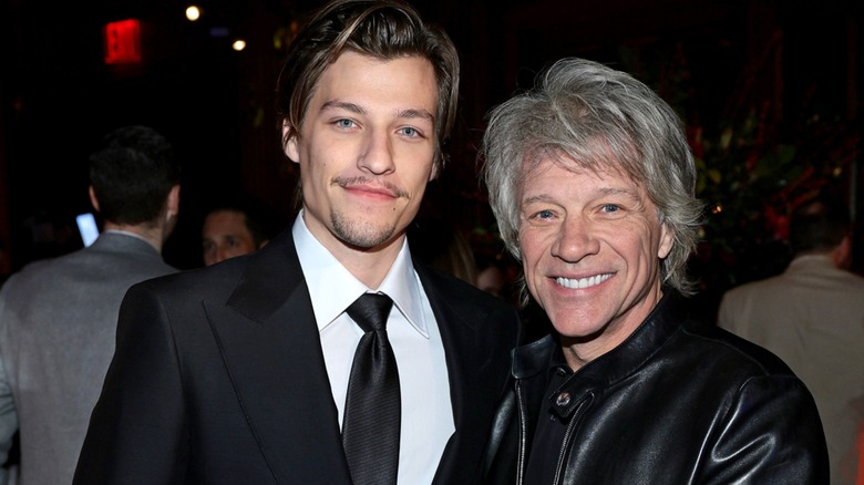 Jake Bongiovi and Jon Bon Jovi smiling side-by-side