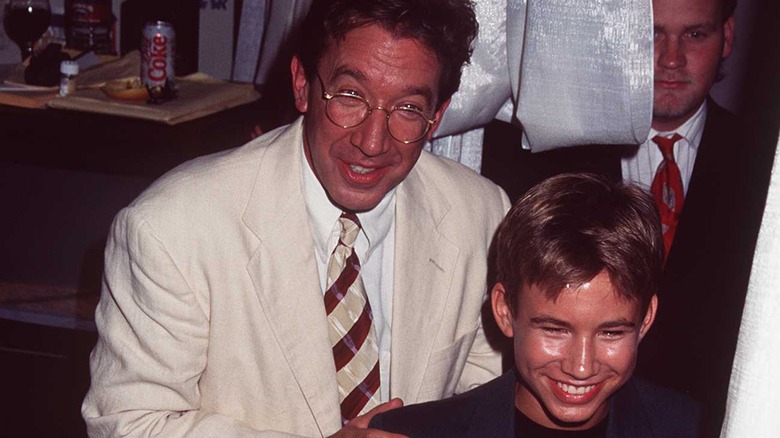 Jonathan Taylor Thomas smiling with Tim Allen