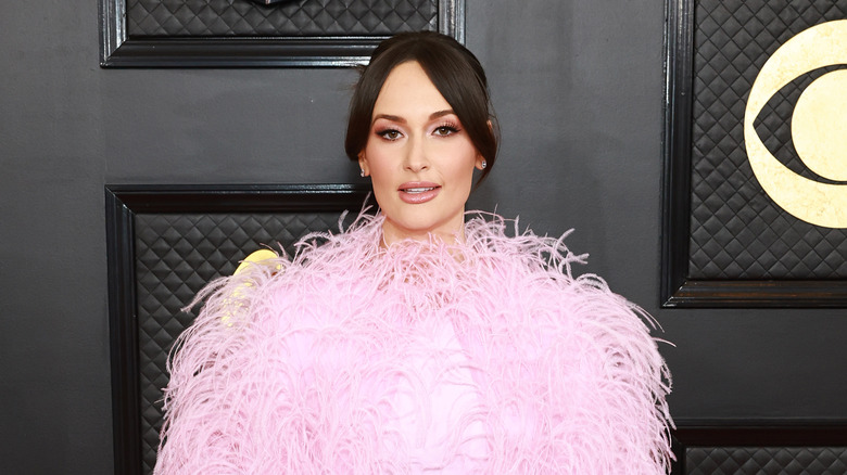 Kacey Musgraves posing in pink