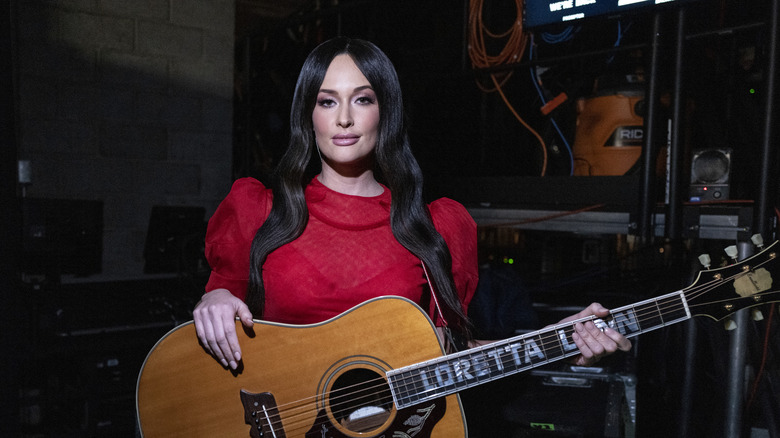 Kacey Musgraves holding guitar