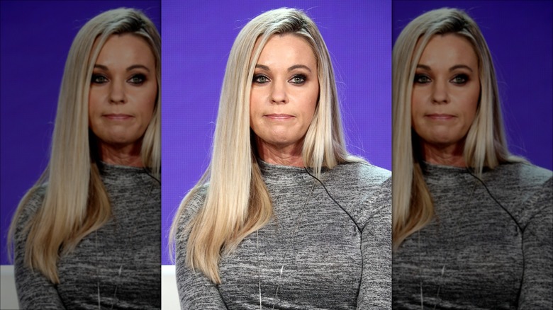 Kate Gosselin with long hair, looking sad against purple background