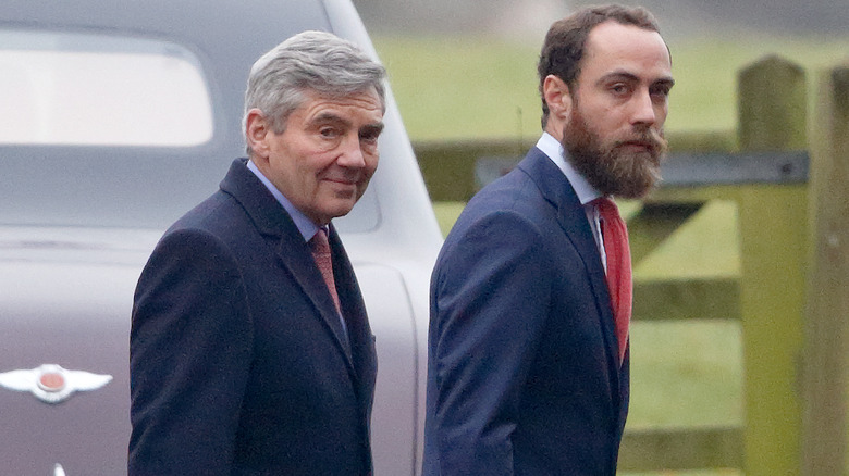 michael middleton walking alongside son james middleton