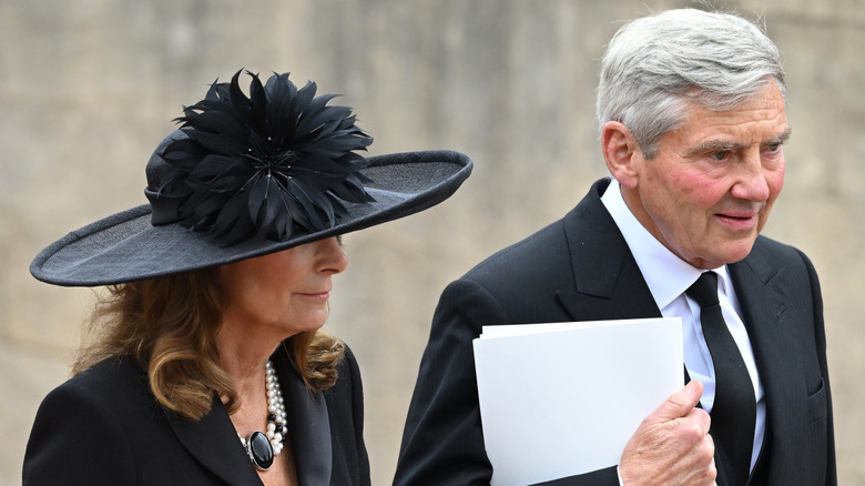 michael and carole middleton walking together