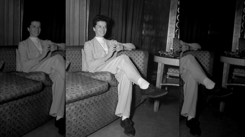 Katharine Hepburn sitting and smiling 