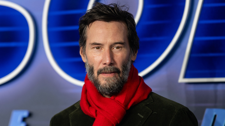 Keanu Reeves wearing a red scarf at "Sonic the Hedgehog 3" premiere