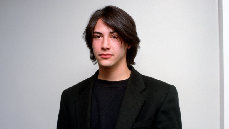 Keanu Reeves wearing black jacket in 1990