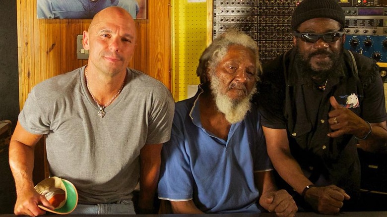 Kenny Chesney, Aston "Family Man" Barrett and friend