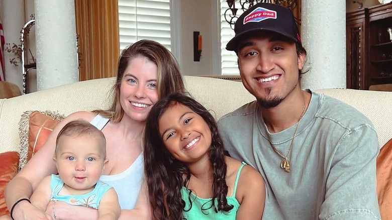 Kid Rock's son Robert James Ritchie Jr. poses with his wife Marisa and their two kids Skye and Ryder (2023)