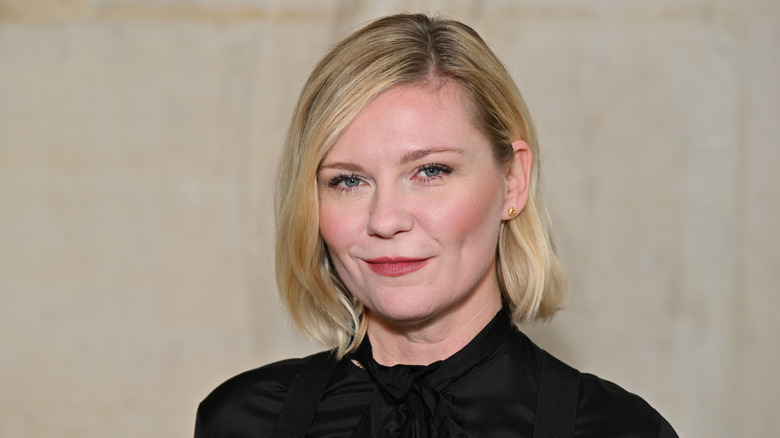 Kirsten Dunst half-smiling