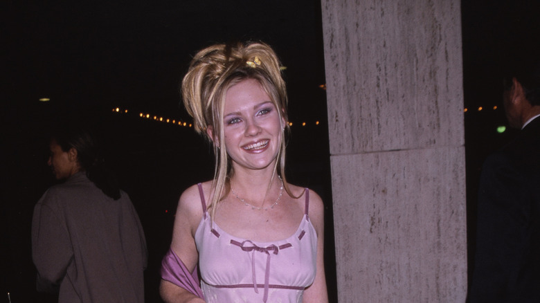 Teenage Kirsten Dunst smiling