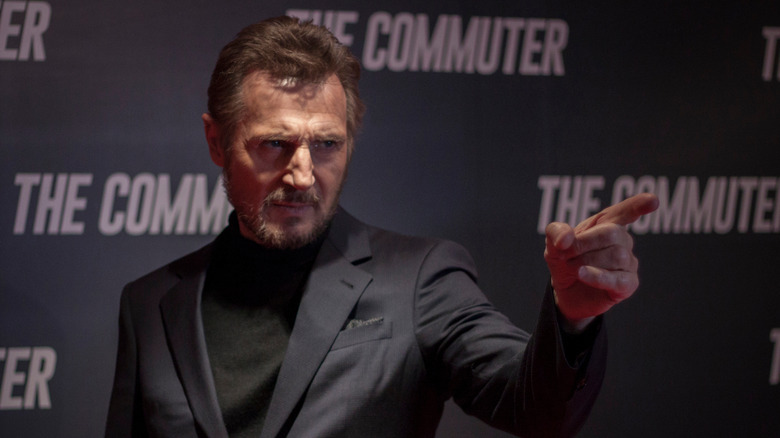 Liam Neeson pointing at a premiere in January 2018