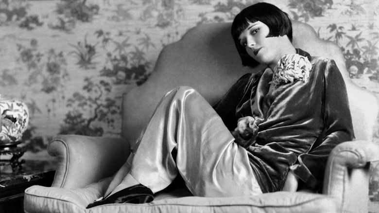 Louise Brooks lounged on a chair 