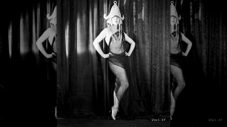 Louise Brooks poses in dance costume and headdress