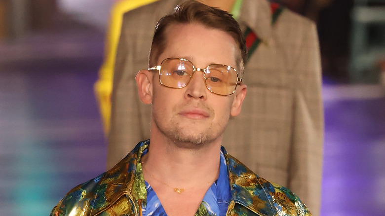 Macaulay Culkin walking at fashion show