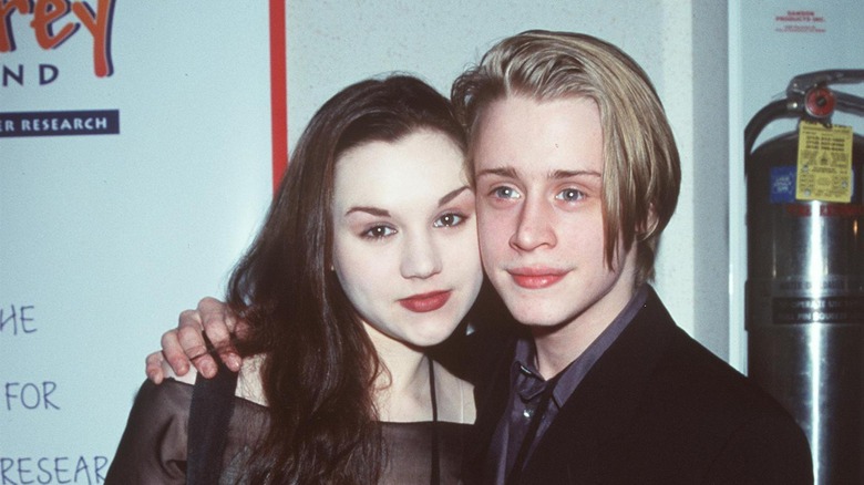 Rachel Miner and Macaulay Culkin smiling