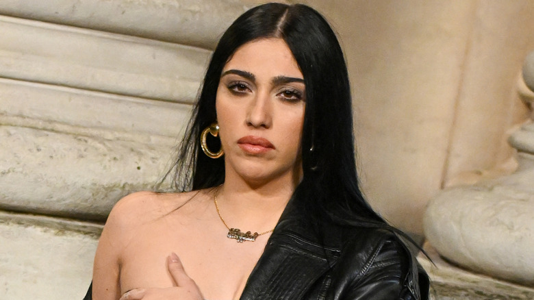 Lourdes Leon wearing gold jewelry at the Saint Laurent Menswear Fall-Winter 2025/2026 show at Paris Fashion Week