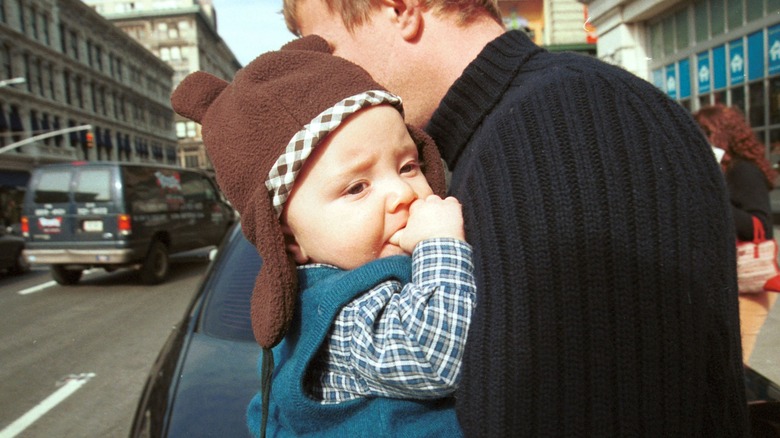 Guy Ritchie holding baby Rocco Ritchie