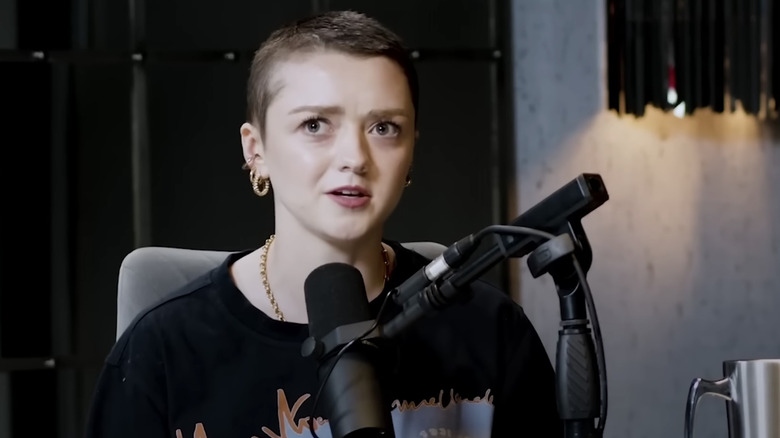 Maisie Williams speaking into microphone