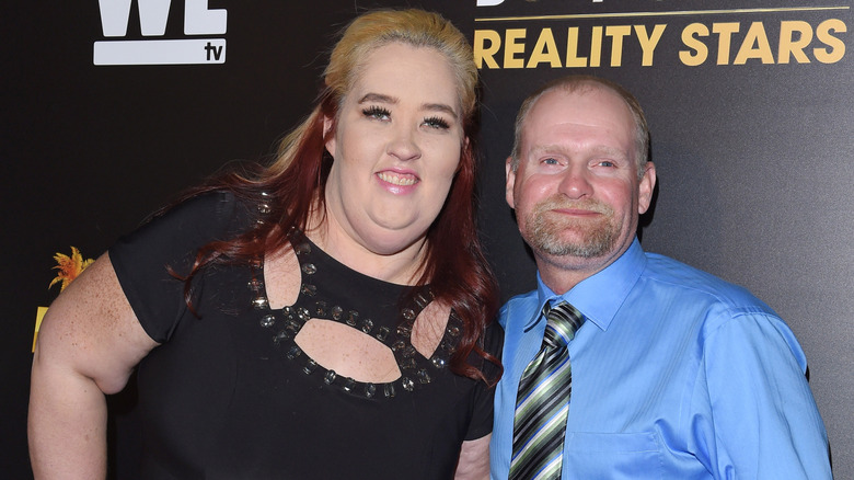 Mama June posing for photos with her husband Mike Thompson