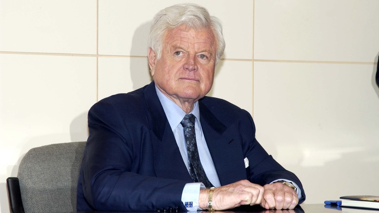 Ted Kennedy sitting at a table