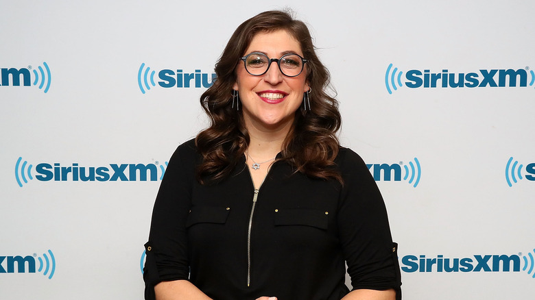 Mayim Bialik smiling with glasses