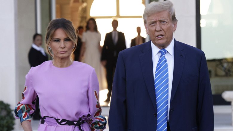 Melania Trump and Donald standing next to each other