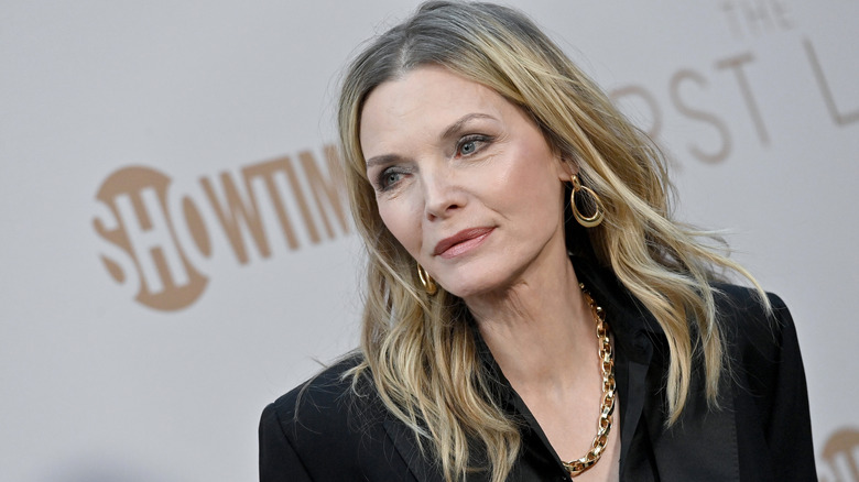 Michelle Pfeiffer in black blazer and gold jewelry