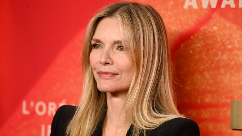 Michelle Pfeiffer against orange background