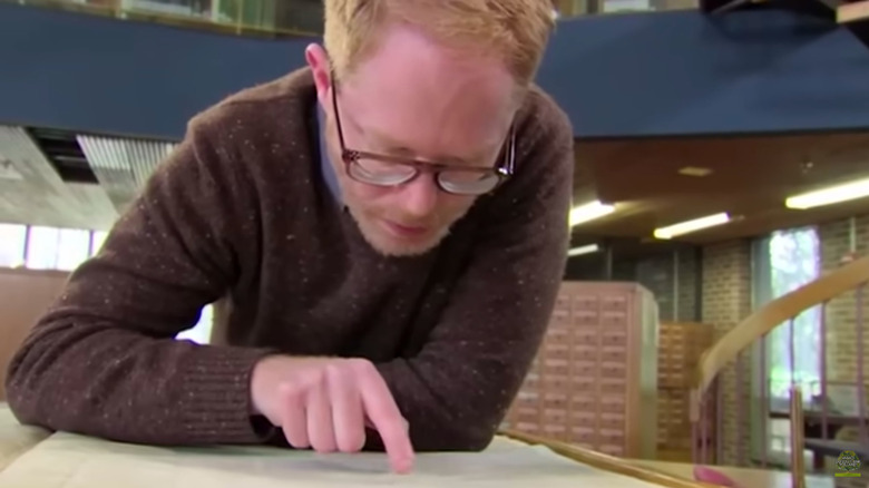 Jesse Tyler Ferguson reading a book