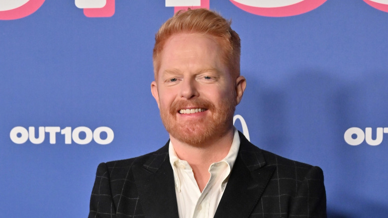 Jesse Tyler Ferguson smiles as he walks the red carpet