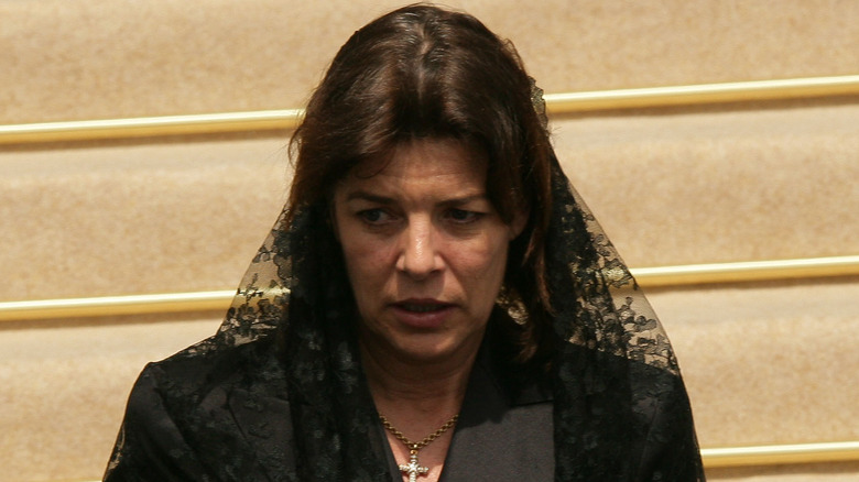 Princess Caroline, at Prince Rainier's funeral, walking