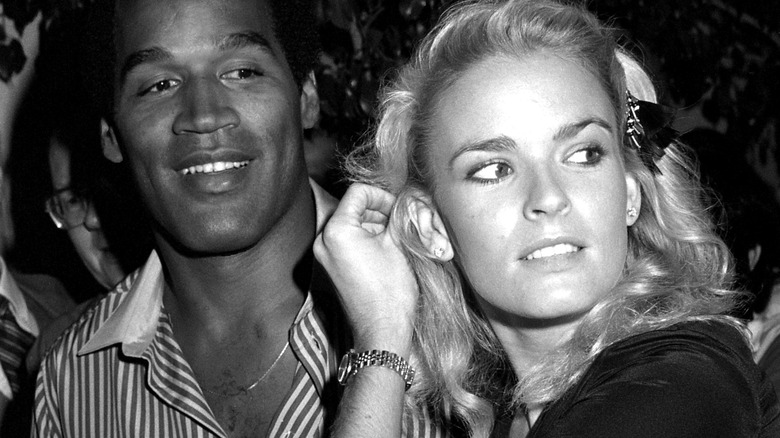 Nicole Brown Simpson and O.J. Simpson smiling 