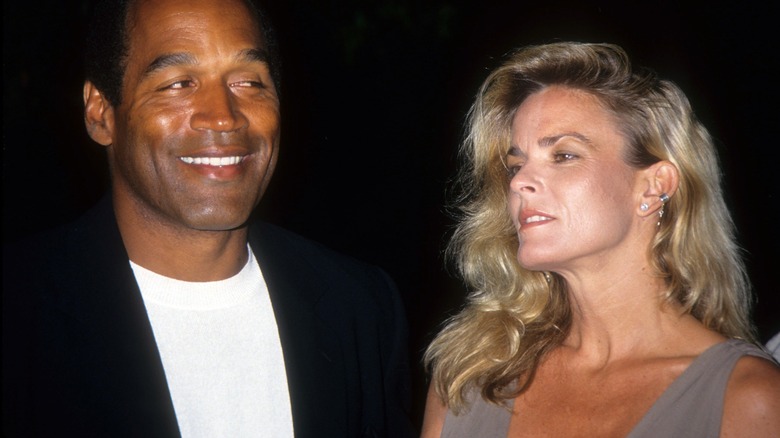 Nicole Brown Simpson and O.J. Simpson smiling 