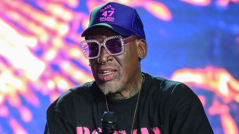 Dennis Rodman speaking into a microphone