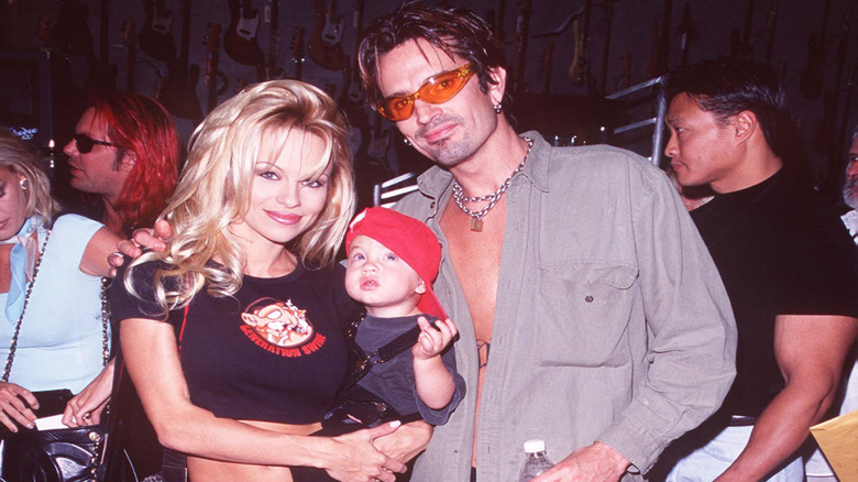 Brandon Thomas Lee with parents Pamela Anderson and Tommy Lee