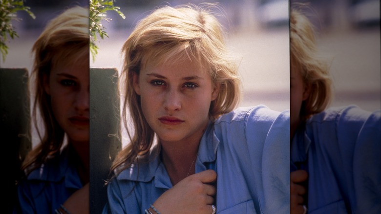 Patricia Arquette wearing a blue shirt in Time Out