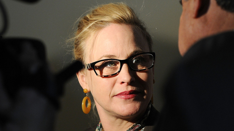 Patricia Arquette wearing glasses at a press conference in California advocating for equal pay