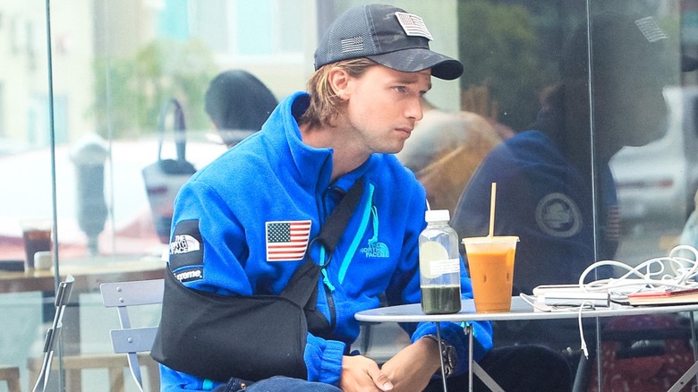 Patrick Schwarzenegger in a sling