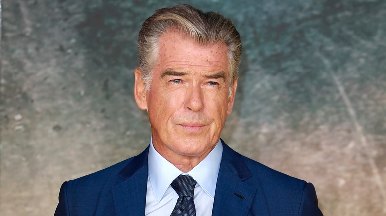 Pierce Brosnan poses on red carpet