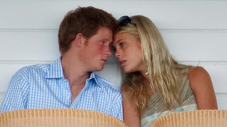 Prince Harry with Chelsy Davy leaning towards each other